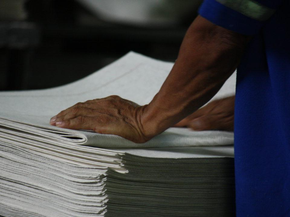 male worker's hands on towels