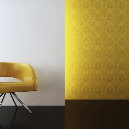 yellow chair in front of a white wall in front of yellow wallpaper