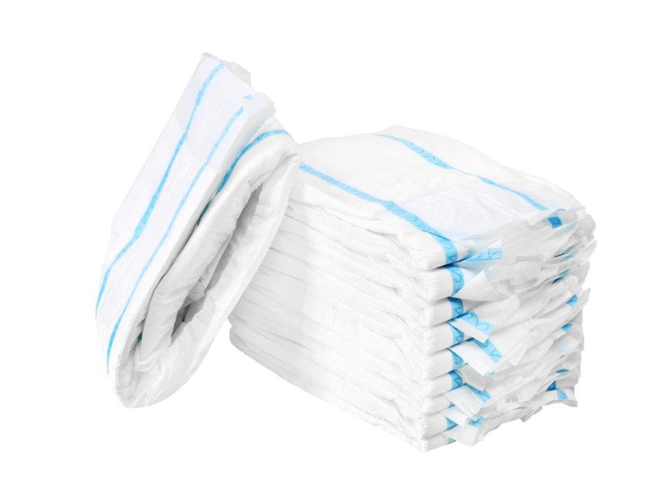 Stack of adult diapers on a white background